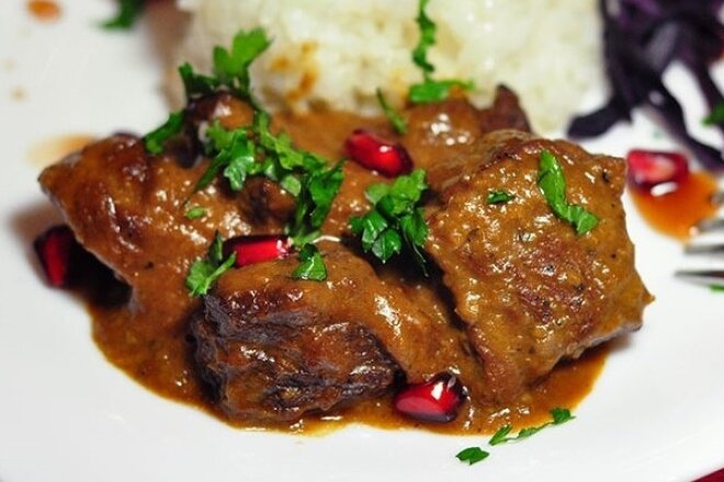 Baked beef with pomegranate sauce