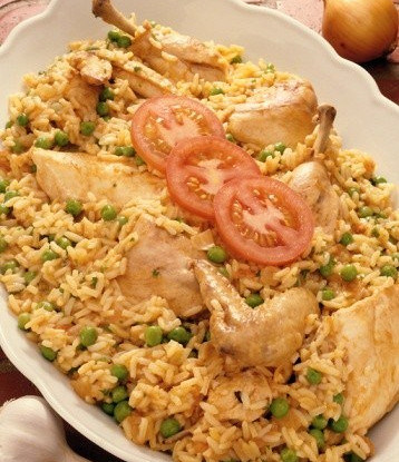 Chicken legs with saffron, rice and green peas