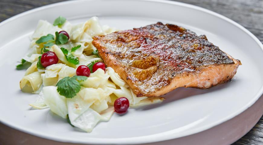 Karelian trout with baked celery and cranberries