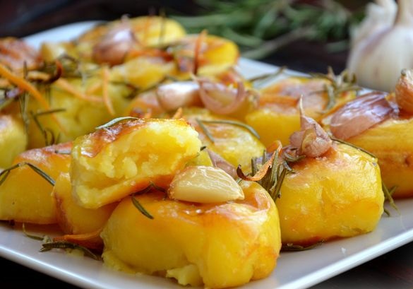 Potatoes baked with rosemary, garlic, zest and butter