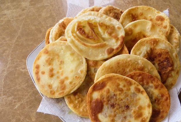 Thin pies with potatoes and meat (stuffed tortillas)