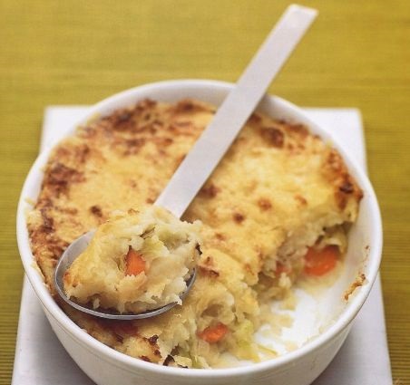 Potato casserole with vegetables under a cheese crust