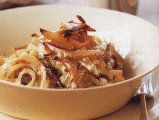 Potatoes in a pot with onions and anchovies