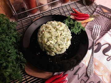 Potato salad with pickled cucumbers and apple
