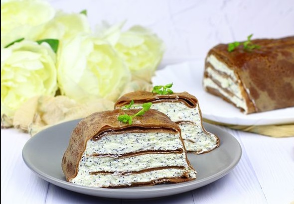 Pancake cake with curd cream, poppy seeds and white chocolate