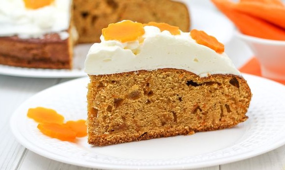 Carrot cake with spices and whipped cream