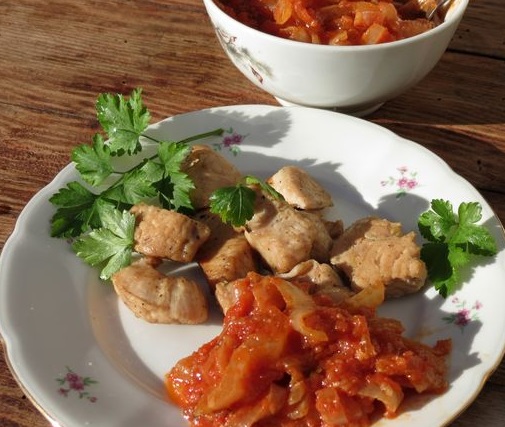 Chicken skewers baked in a sleeve with tomato-onion sauce
