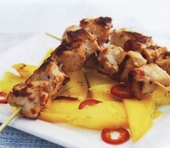 Pork skewers with mango and chili