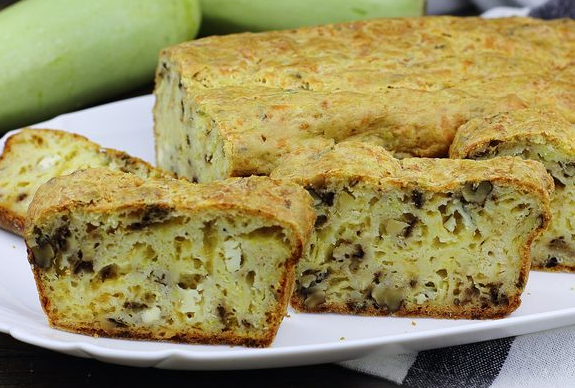 Zucchini and cheese snack cake with nuts