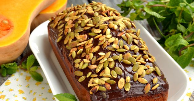 Spicy pumpkin cake with chocolate icing and seeds