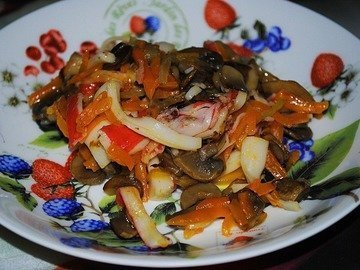 Salad of fried champignons and crab sticks