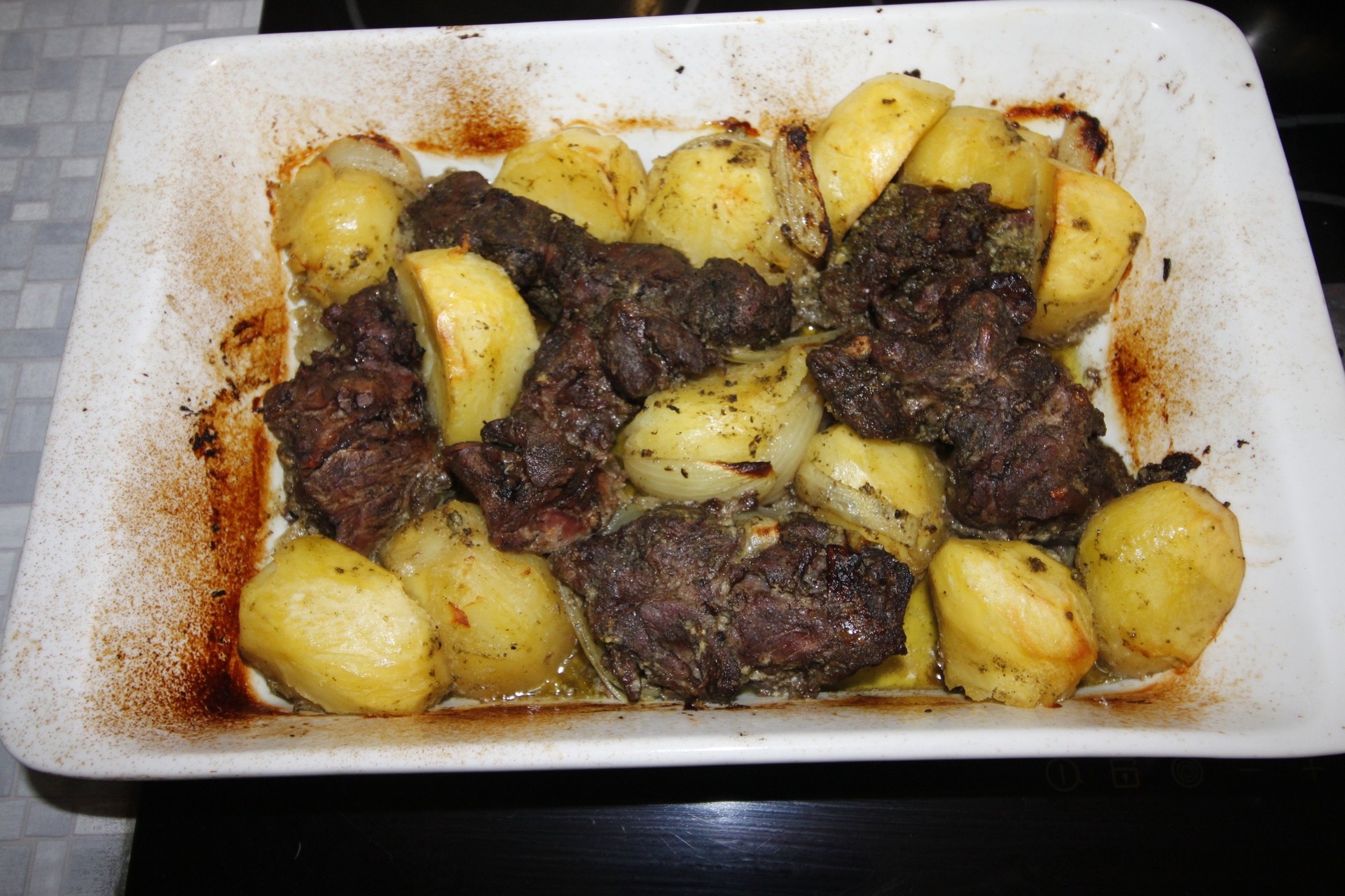 Camel meat with potatoes in the oven