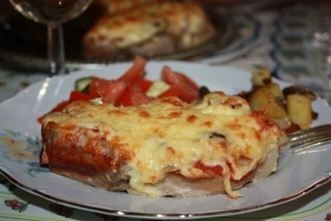 Pork with tomatoes and cheese in foil