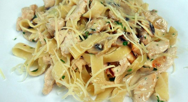 Tasty Pasta with chicken and mushrooms in a creamy sauce
