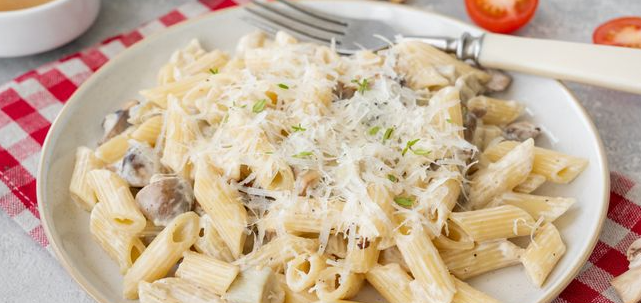 Pasta with eggplant and mushrooms in a creamy sauce