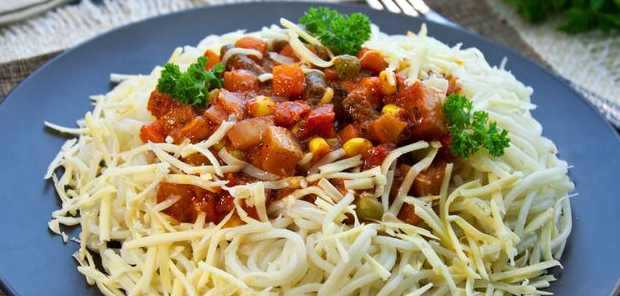 Spaghetti with frozen vegetables in tomato sauce and cheese