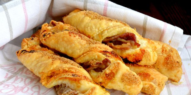 Crispy puff pastry sticks with bacon, cheese and spices