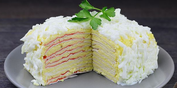 Snack cake from crab sticks with cheese and eggs