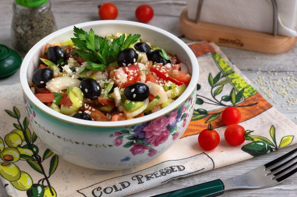 Vegetable salad with olives and sesame seeds