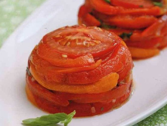 Cold appetizer of tomatoes and bell peppers