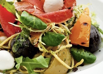 Warm potato salad with olives and peppers