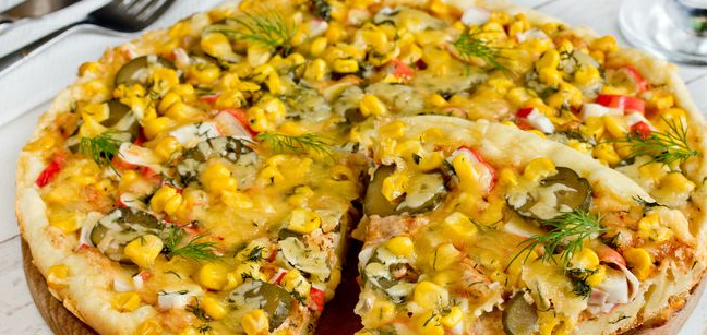 Pizza in a pan, with crab sticks and corn