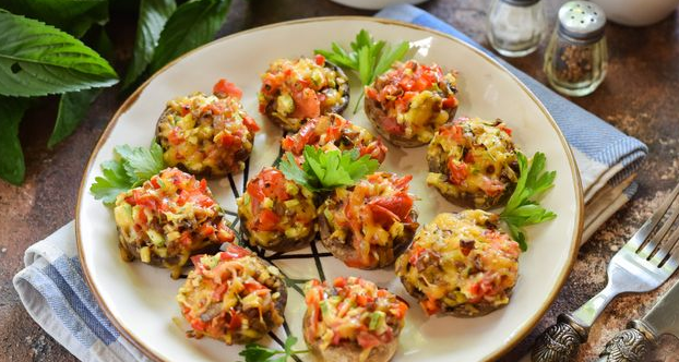 Mushrooms baked with vegetables and cheese