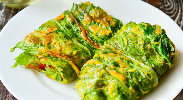 Chinese cabbage rolls with tomatoes and cheese
