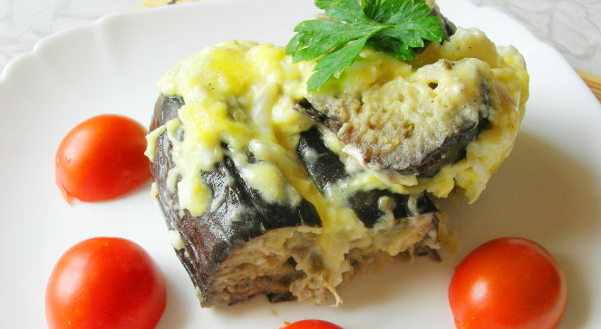 Baked eggplant with cheese and egg, with sour cream and mayonnaise sauce