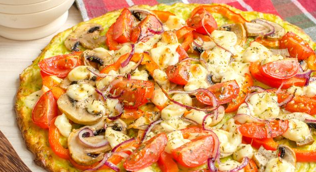 Zucchini pizza with tomatoes, peppers and mushrooms