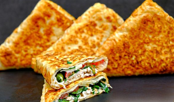 Lavash envelopes stuffed with chicken, tomato, cheese and herbs