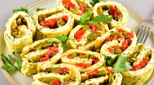Tasty Egg roll with cottage cheese and sweet pepper filling