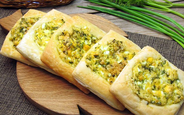 Tasty Snack puffs with boiled eggs, cheese and herbs