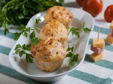 Muffins with sausage, cheese and tomatoes