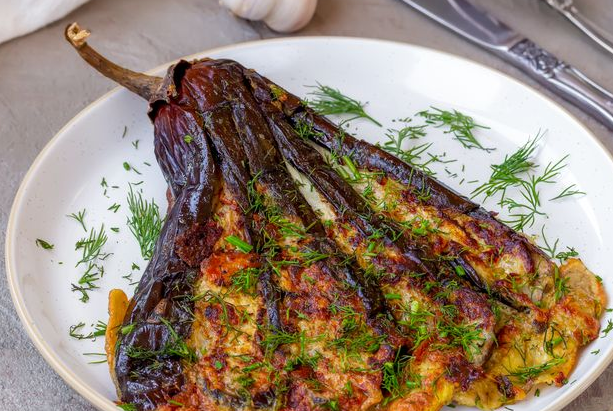 Baked eggplant fried with egg and garlic