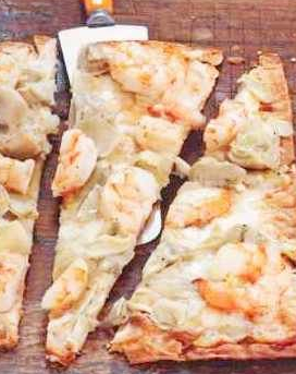 Tasty Lavash pizza with shrimps and artichokes