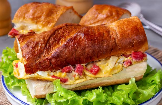 Hot sandwiches with scrambled eggs and sausage