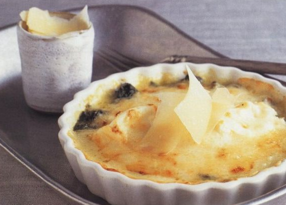 Tasty Poached eggs with spinach and cheese sauce