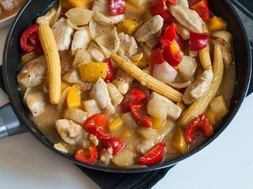 Chicken in sweet and sour sauce with vegetables