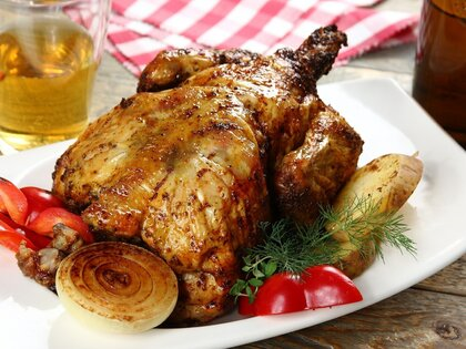 Chicken baked on a beer bottle