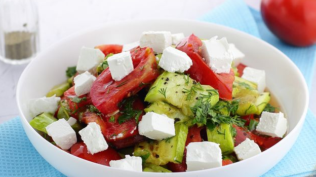 Salad with baked zucchini, tomatoes and cheese