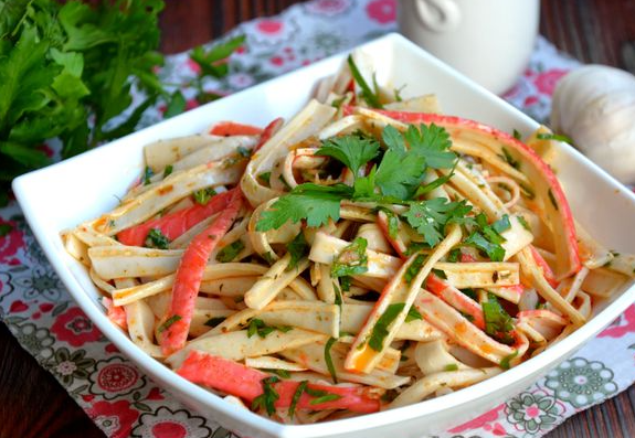 Salad with crab sticks, parsley and spicy dressing