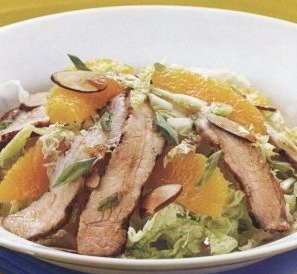 Salad of pork meat, oranges and Chinese cabbage