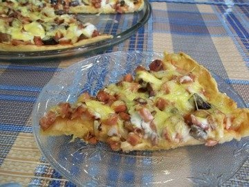 Homemade pizza with sausage and mushrooms