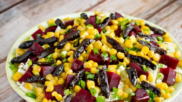 Salad with Chinese cabbage, beets, corn and prunes