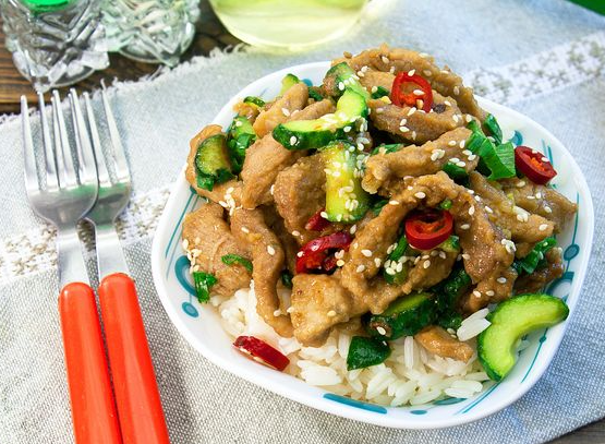 Fried pork with cucumbers, garlic, ginger and chili peppers