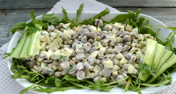 Salad with chicken hearts, avocado and arugula