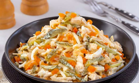 Salad with chicken, dried apricots, pickles and eggs