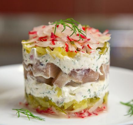 Layered salad with herring and sour cream