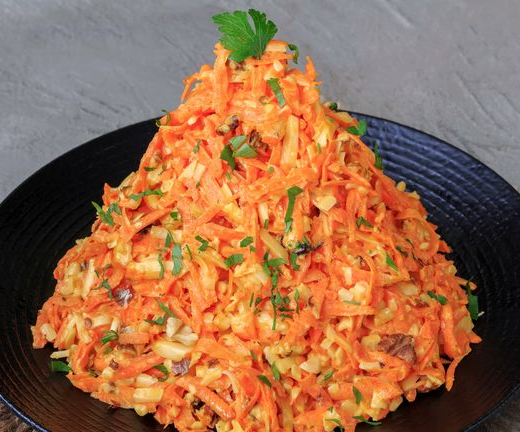 Carrot salad with cheese, nuts and garlic